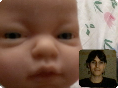 the webcomrade on facetime with a baby doll head