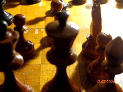 a chess board seen from behind the white king