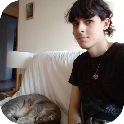 me on our couch with leonel the gray cat